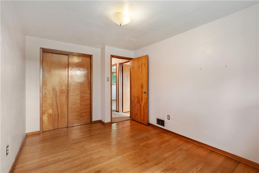 77 Observatory Street Manor, PA 15665 - Photo 14 of 25 an empty room with wooden floor and closet