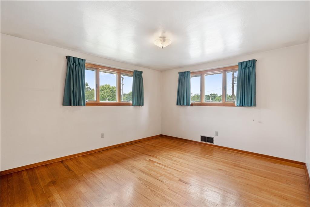 77 Observatory Street Manor, PA 15665 - Photo 15 of 25 a view of an empty room with wooden floor and a window