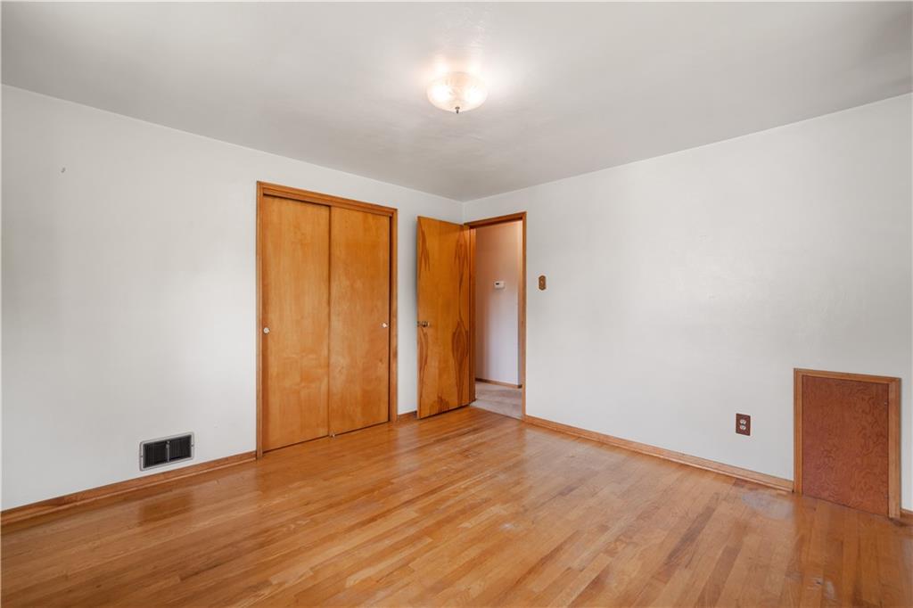 77 Observatory Street Manor, PA 15665 - Photo 18 of 25 a view of empty room with wooden floor and fan