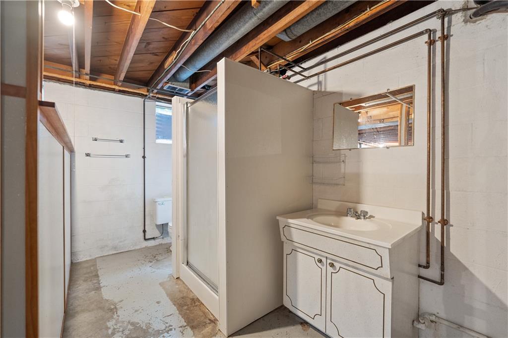 77 Observatory Street Manor, PA 15665 - Photo 20 of 25 a bathroom with a sink and a mirror