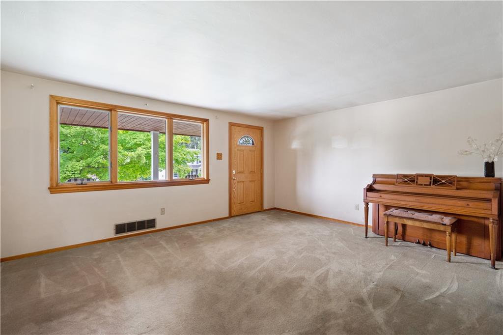 77 Observatory Street Manor, PA 15665 - Photo 6 of 25 an empty room with furniture and a window