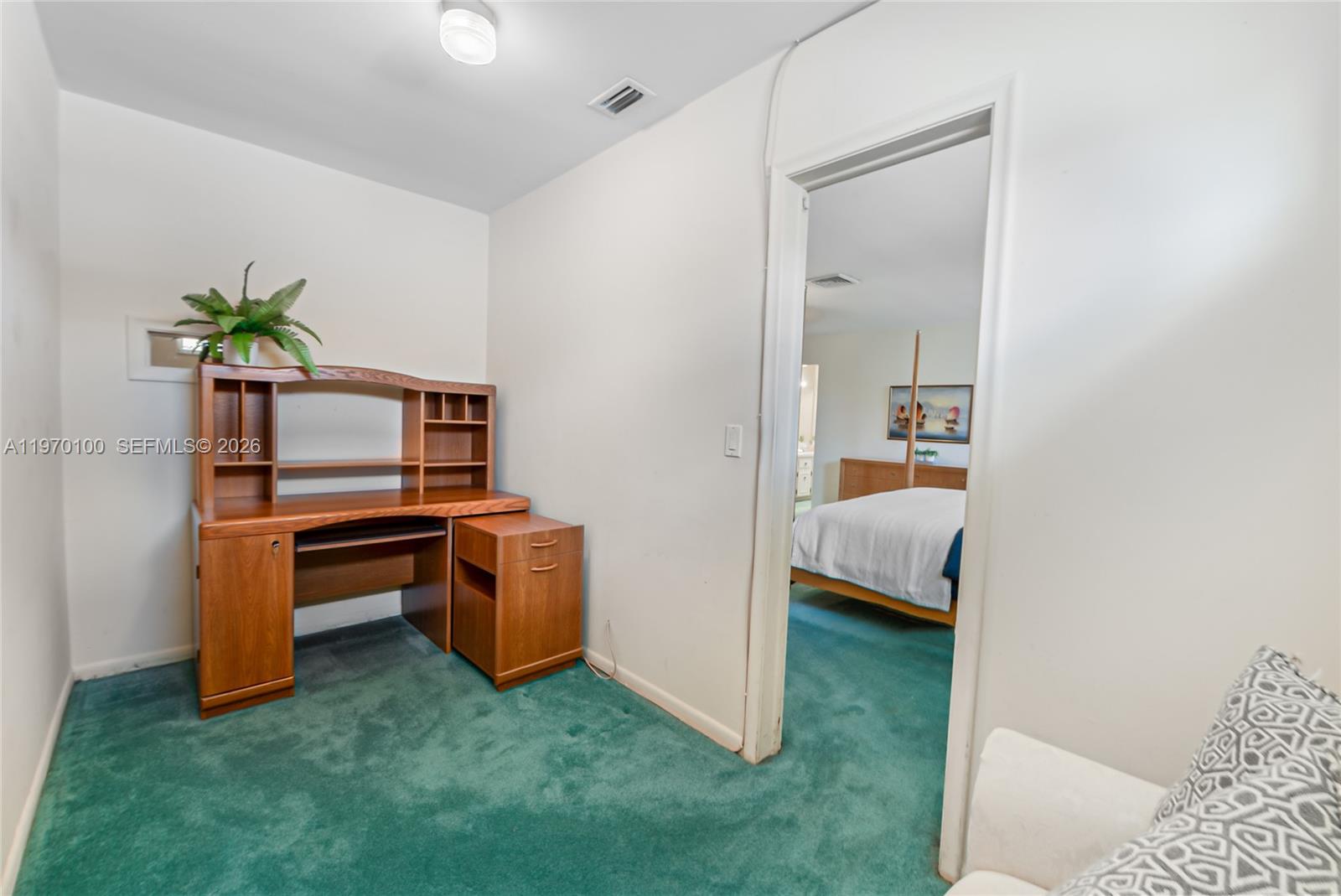 4931 Madison Street Hollywood, FL 33021 - Photo 20 of 26 a room with a bed and furniture