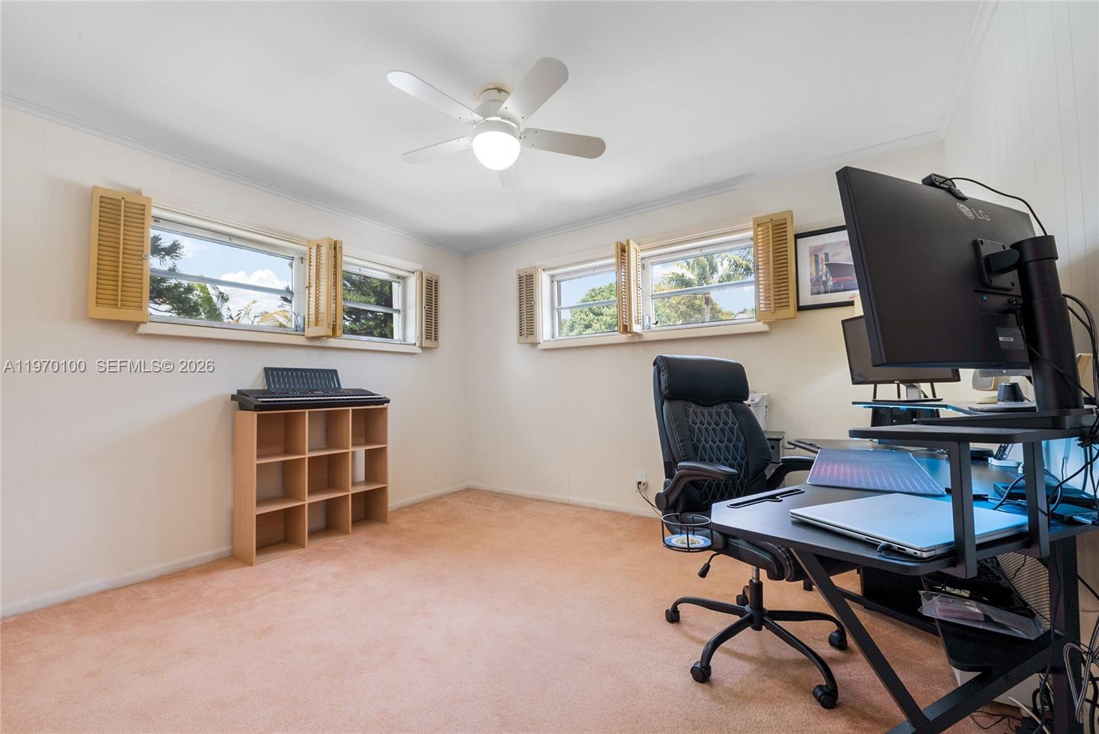 4931 Madison Street Hollywood, FL 33021 - Photo 22 of 26 a view of a workspace with furniture and a window