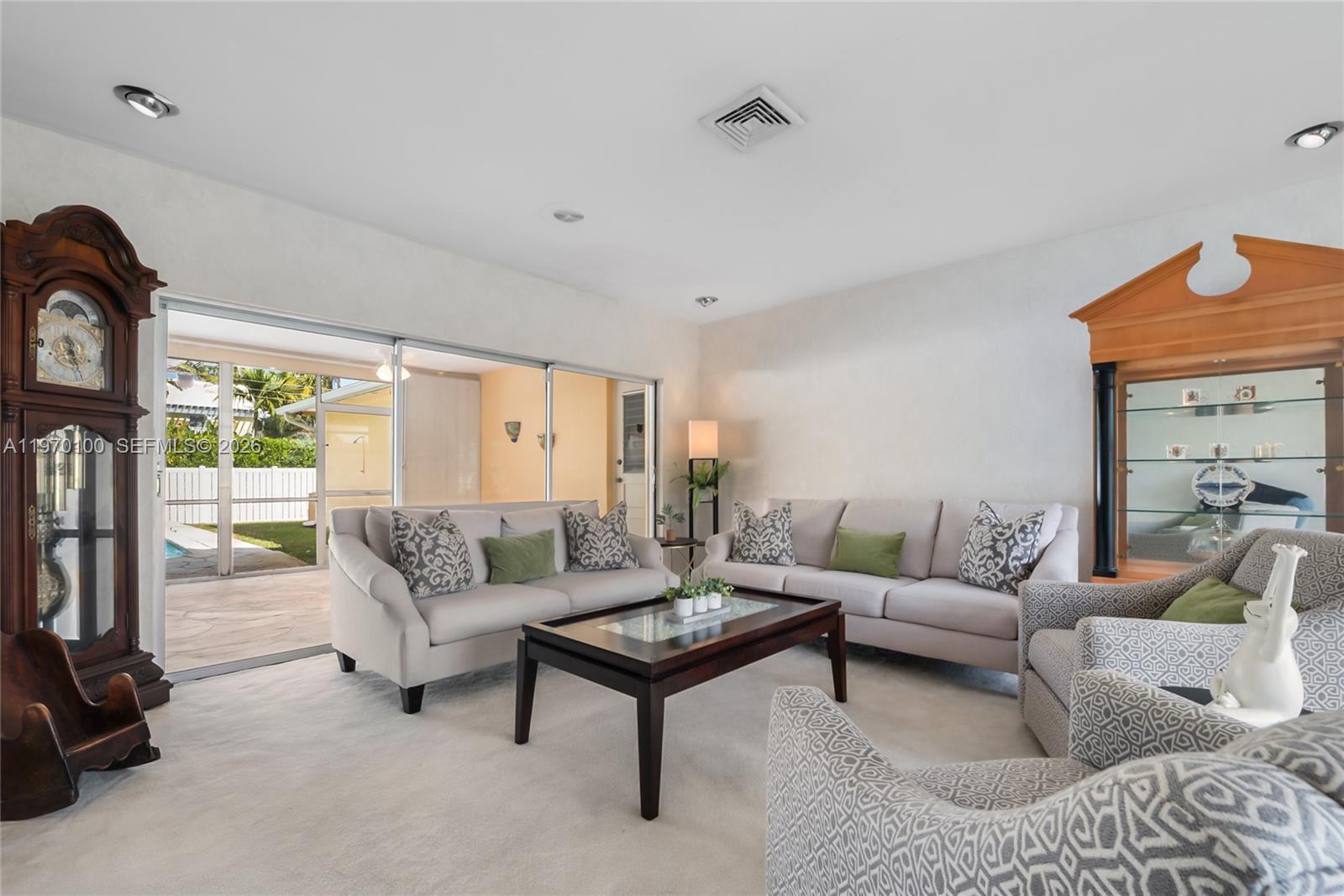 4931 Madison Street Hollywood, FL 33021 - Photo 5 of 26 a living room with furniture and a large window