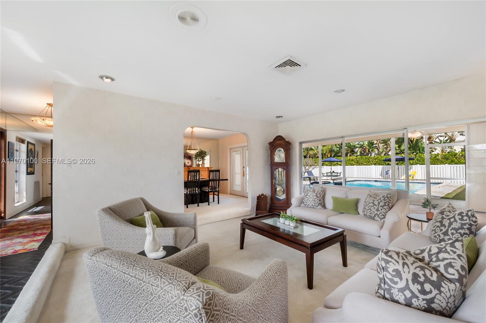 4931 Madison Street Hollywood, FL 33021 - Photo 6 of 26 a living room with furniture and a large window