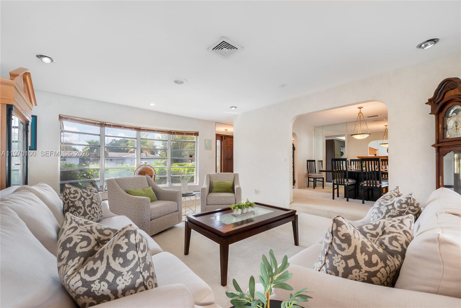4931 Madison Street Hollywood, FL 33021 - Photo 7 of 26 a living room with furniture and a large window