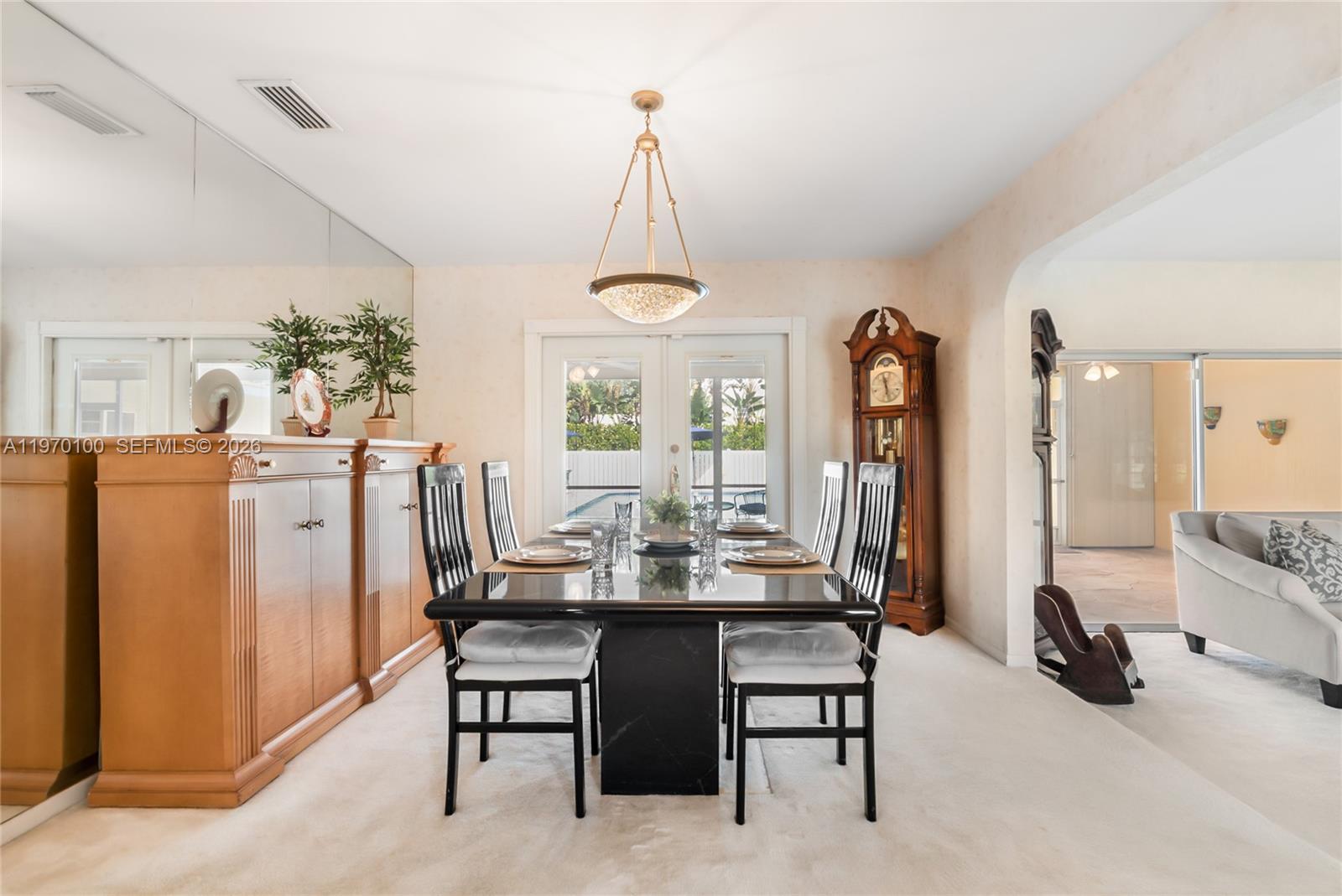 4931 Madison Street Hollywood, FL 33021 - Photo 8 of 26 a dining room with furniture and window