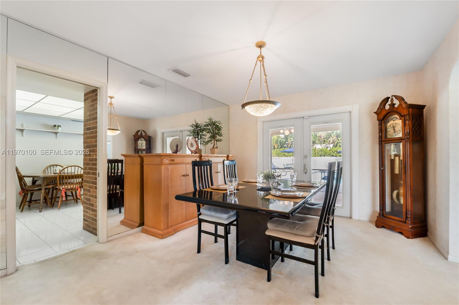 4931 Madison Street Hollywood, FL 33021 - Photo 9 of 26 a view of a dining room with furniture and window