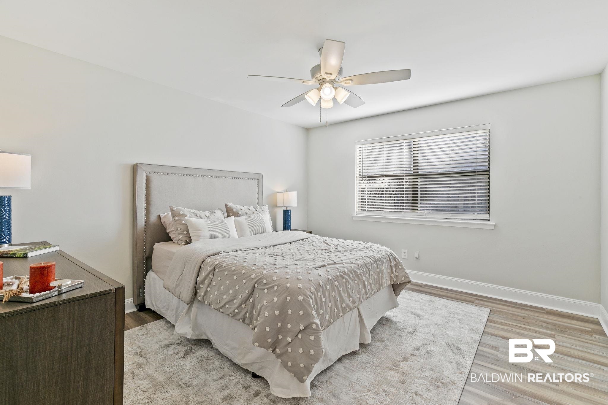 110 5th Street, Unit C103 Daphne, AL 36526 - Photo 31 of 46 Bedroom with light wood-type flooring and ceiling fan