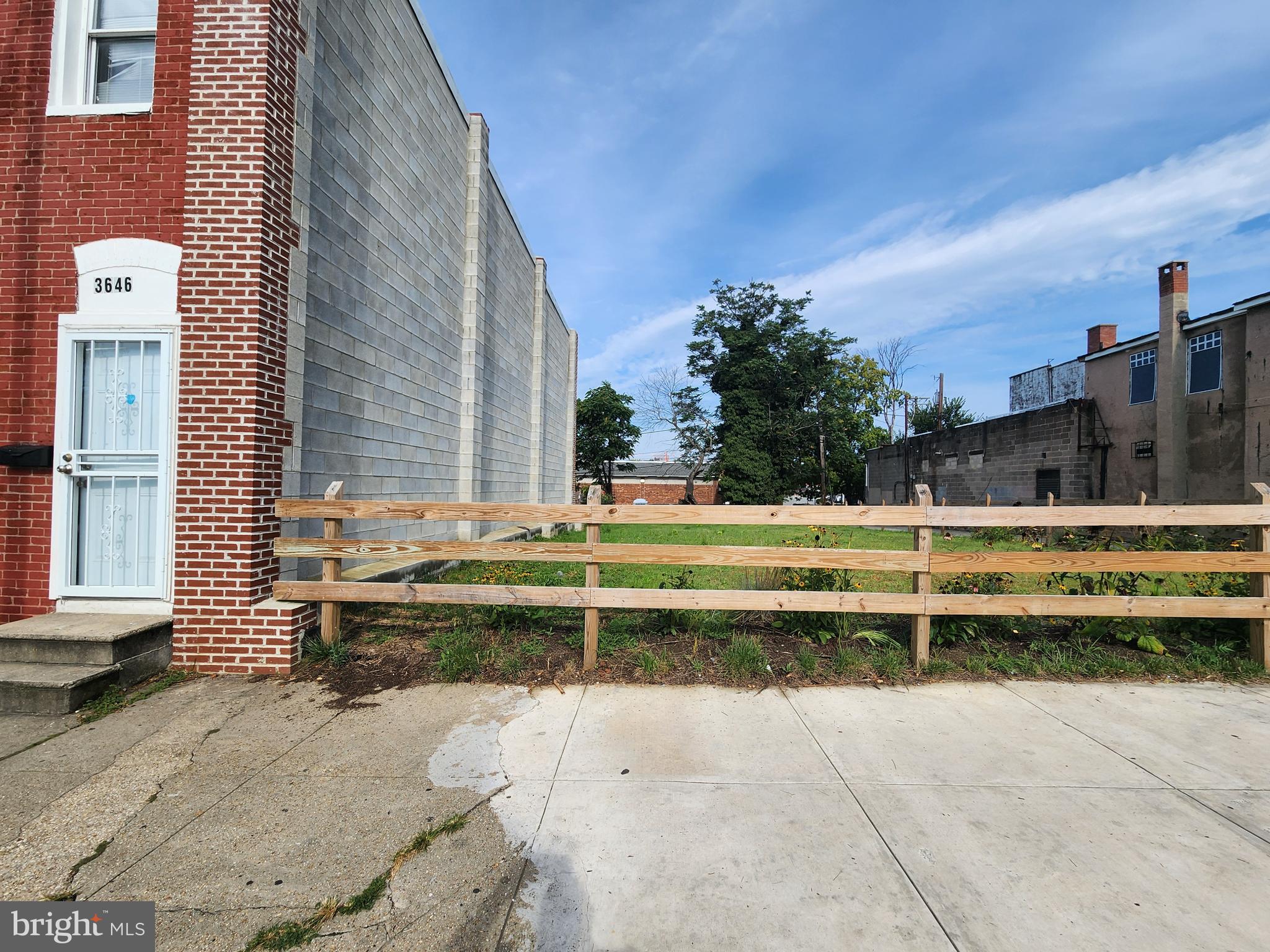 3644 South Hanover Street Baltimore, MD 21225 - Photo 3 of 6 a view of swimming pool with outdoor seating and house in the background