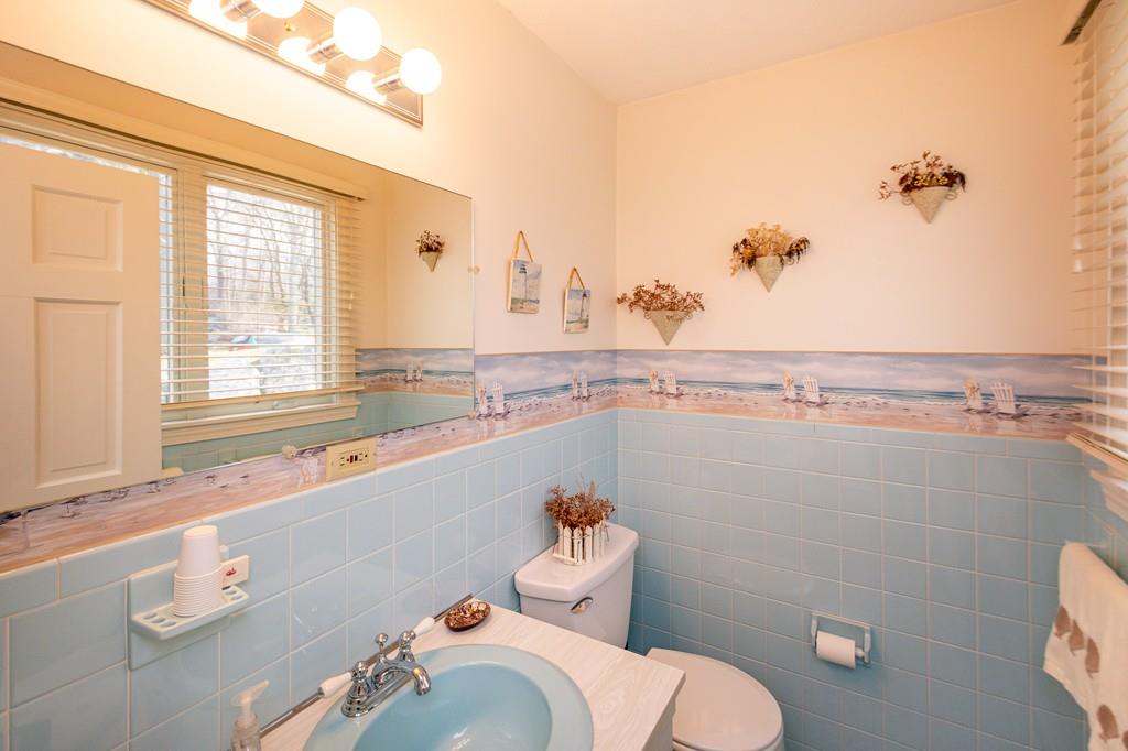 33 Windy Hill Road Cohasset, MA 02025 - Photo 18 of 42 a bathroom with a sink mirror and toilet