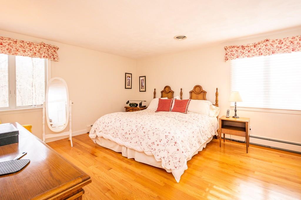 33 Windy Hill Road Cohasset, MA 02025 - Photo 25 of 42 a bedroom with a bed and a window