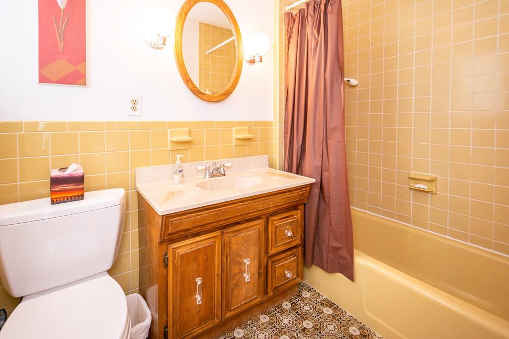 33 Windy Hill Road Cohasset, MA 02025 - Photo 27 of 42 a bathroom with a sink a toilet and a mirror