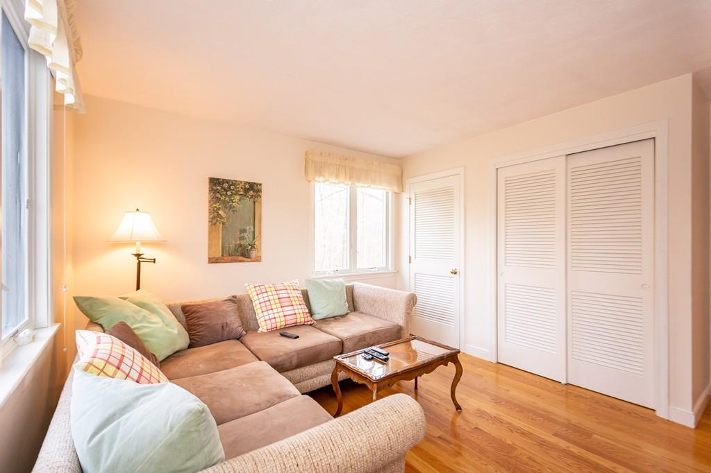 33 Windy Hill Road Cohasset, MA 02025 - Photo 31 of 42 a living room with furniture and a lamp