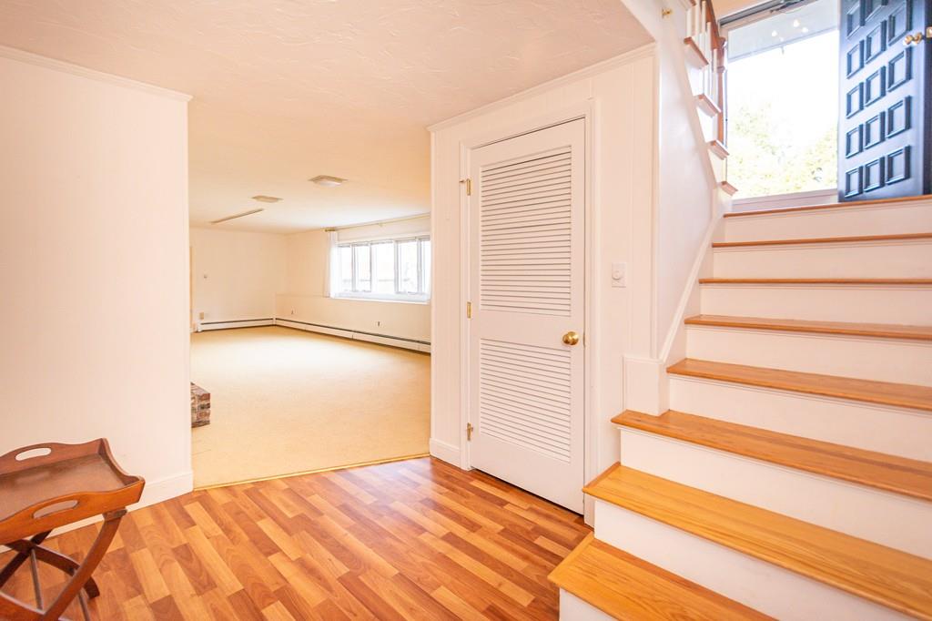 33 Windy Hill Road Cohasset, MA 02025 - Photo 32 of 42 a view of an empty room with wooden floor and a window