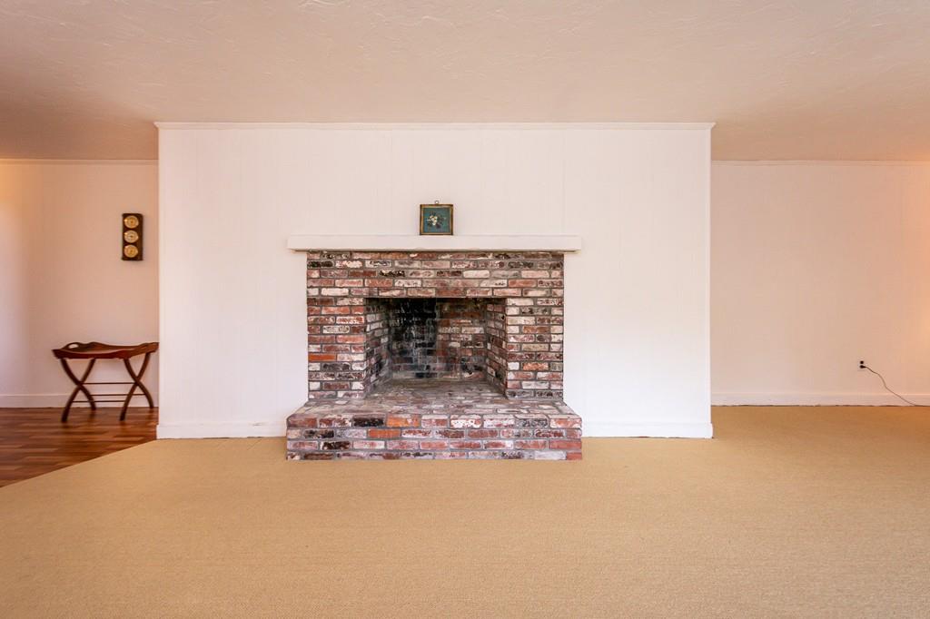 33 Windy Hill Road Cohasset, MA 02025 - Photo 35 of 42 a living room with furniture and a fireplace