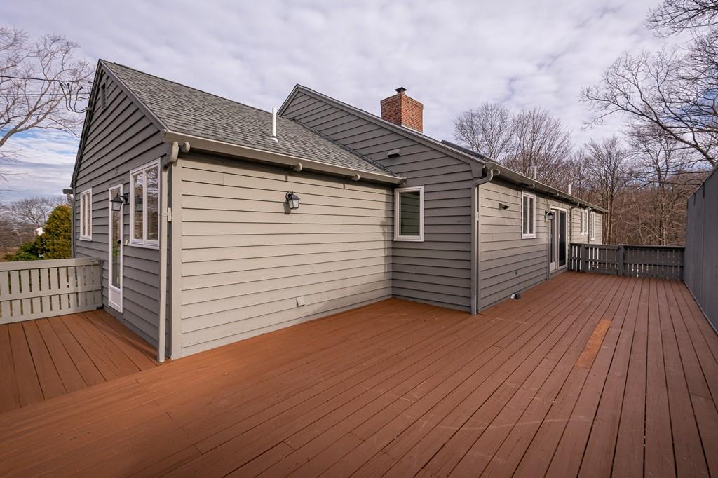33 Windy Hill Road Cohasset, MA 02025 - Photo 7 of 42 a view of a house with a wooden deck