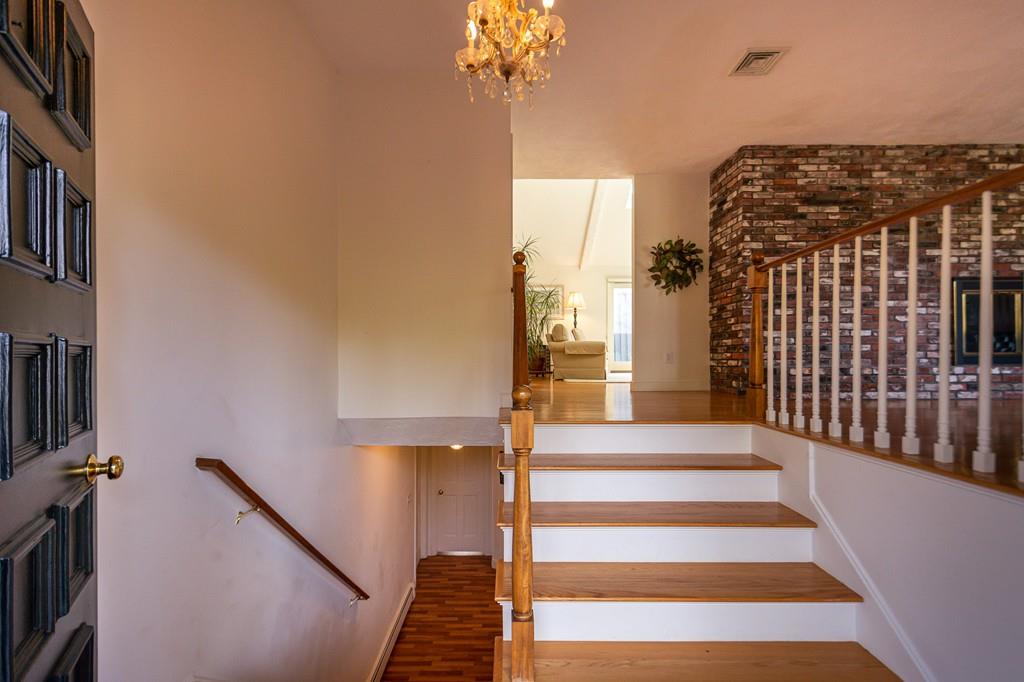 33 Windy Hill Road Cohasset, MA 02025 - Photo 9 of 42 a view of entryway and hall with wooden floor