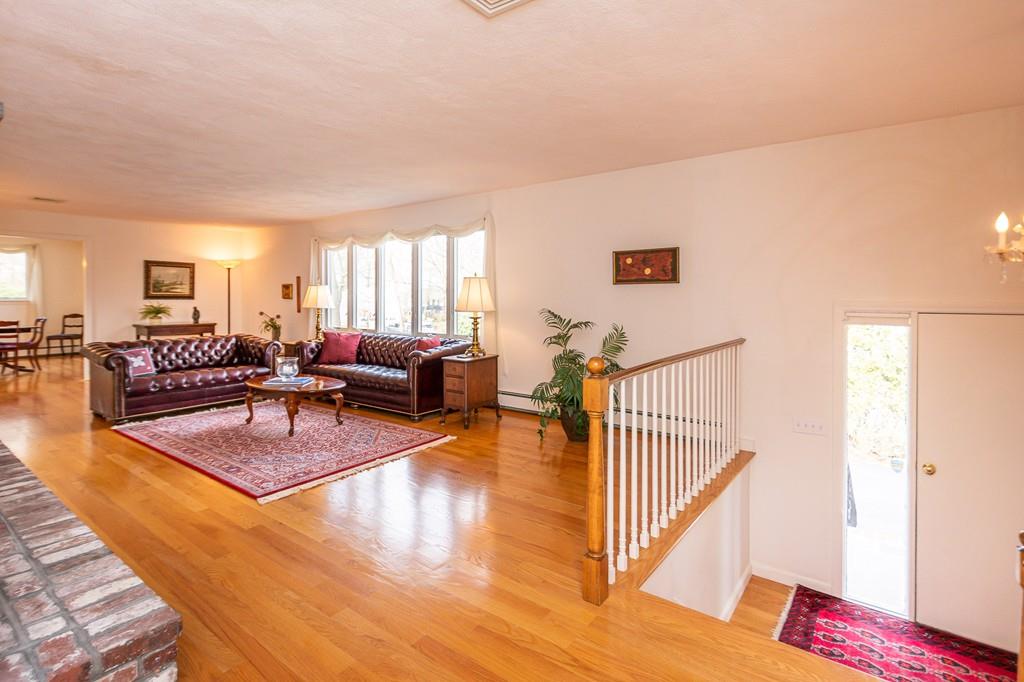 33 Windy Hill Road Cohasset, MA 02025 - Photo 10 of 42 a living room with furniture and a table