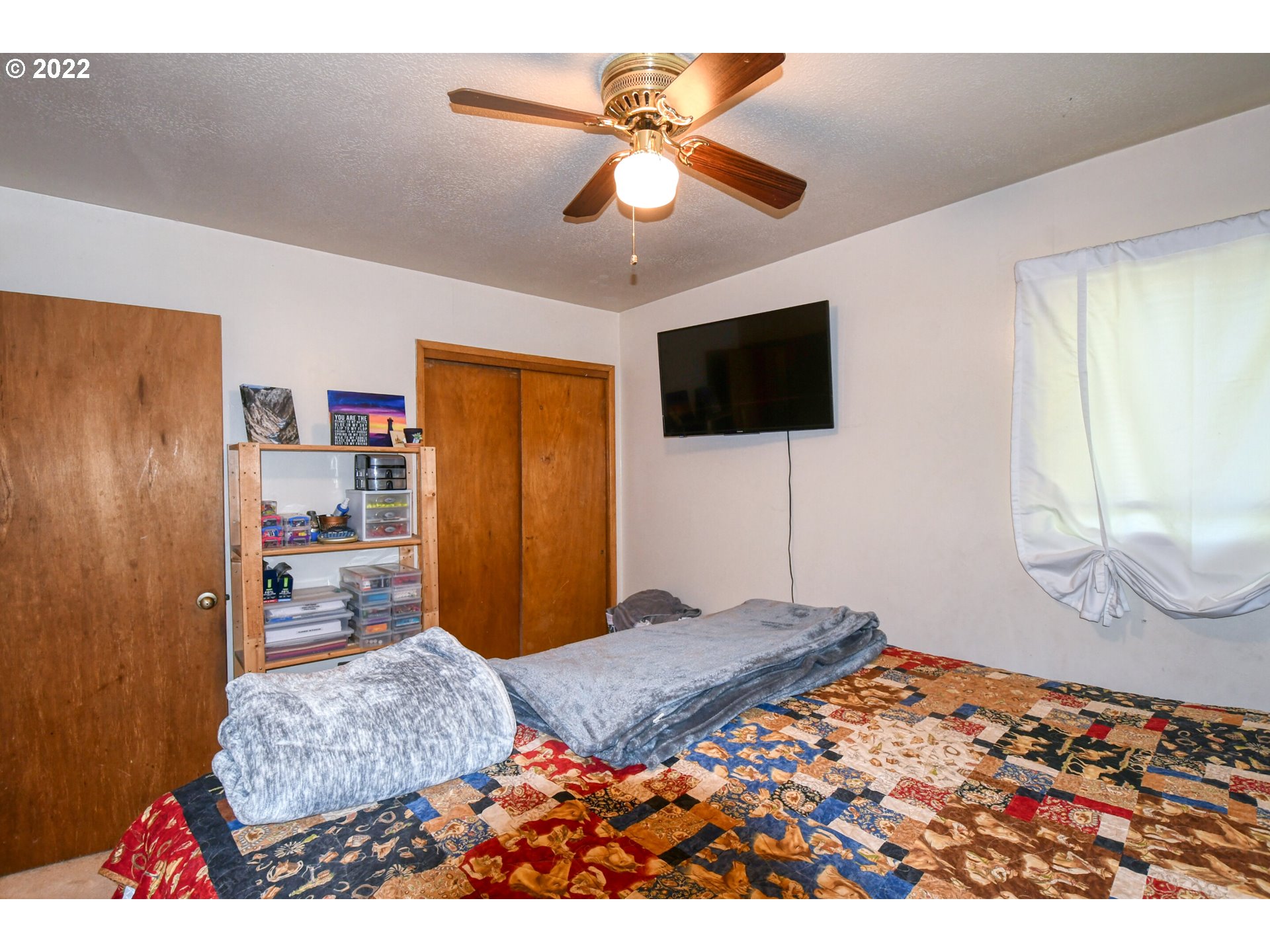 3308 Southwest Kirk Avenue Pendleton, OR 97801 - Photo 11 of 32 a bedroom with a bed and a flat screen tv