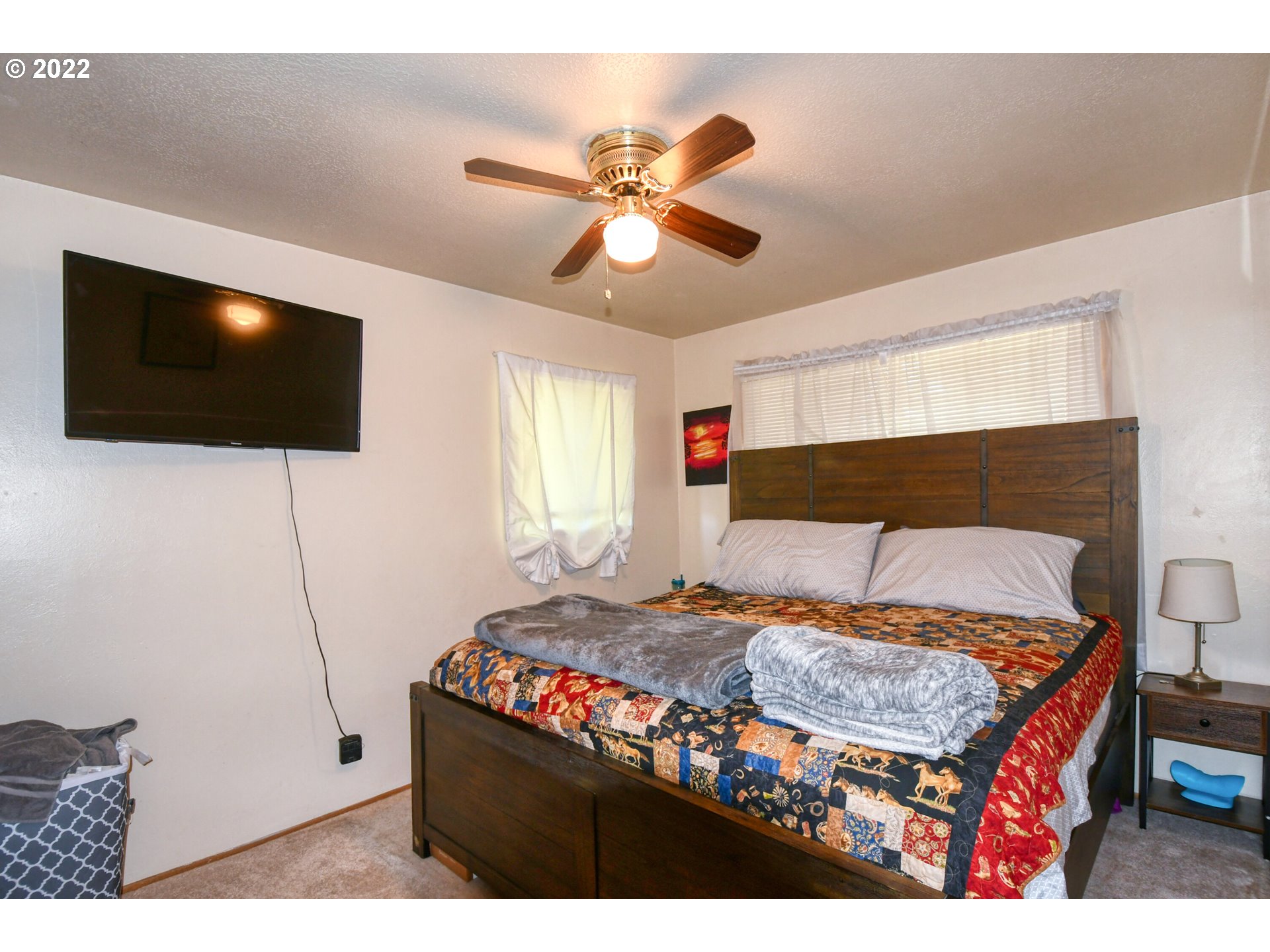 3308 Southwest Kirk Avenue Pendleton, OR 97801 - Photo 12 of 32 a bedroom with a bed and a flat screen tv