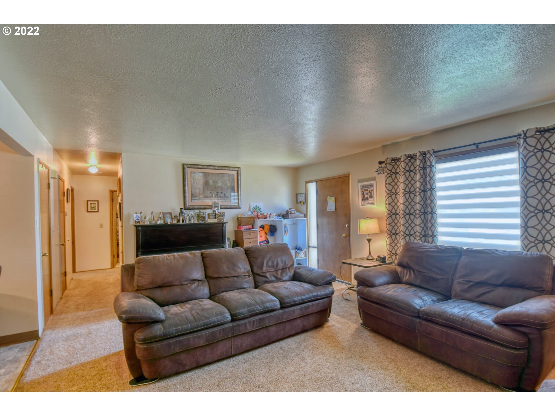 3308 Southwest Kirk Avenue Pendleton, OR 97801 - Photo 4 of 32 a living room with furniture and a large window