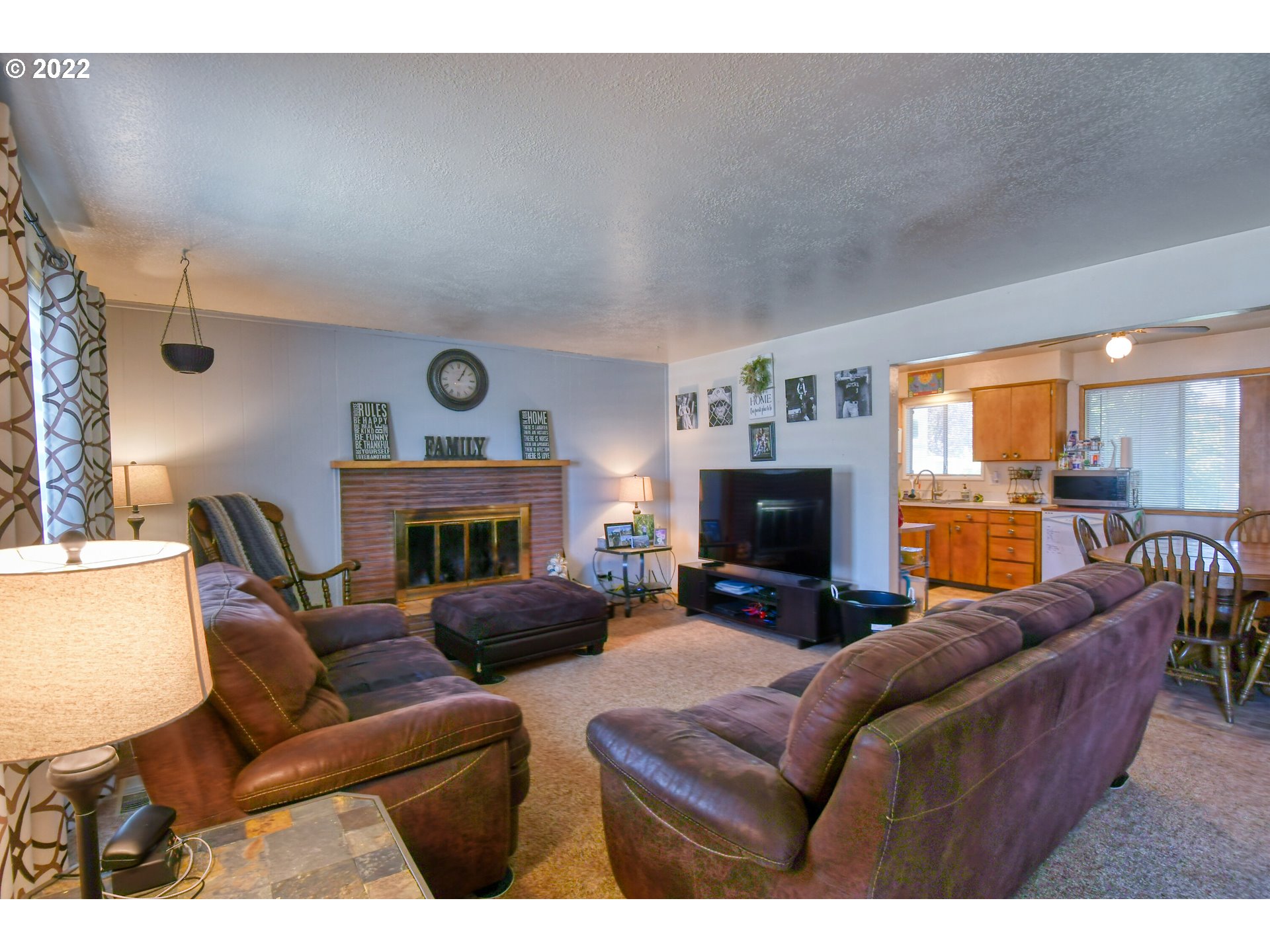 3308 Southwest Kirk Avenue Pendleton, OR 97801 - Photo 5 of 32 a living room with furniture fireplace and a large window
