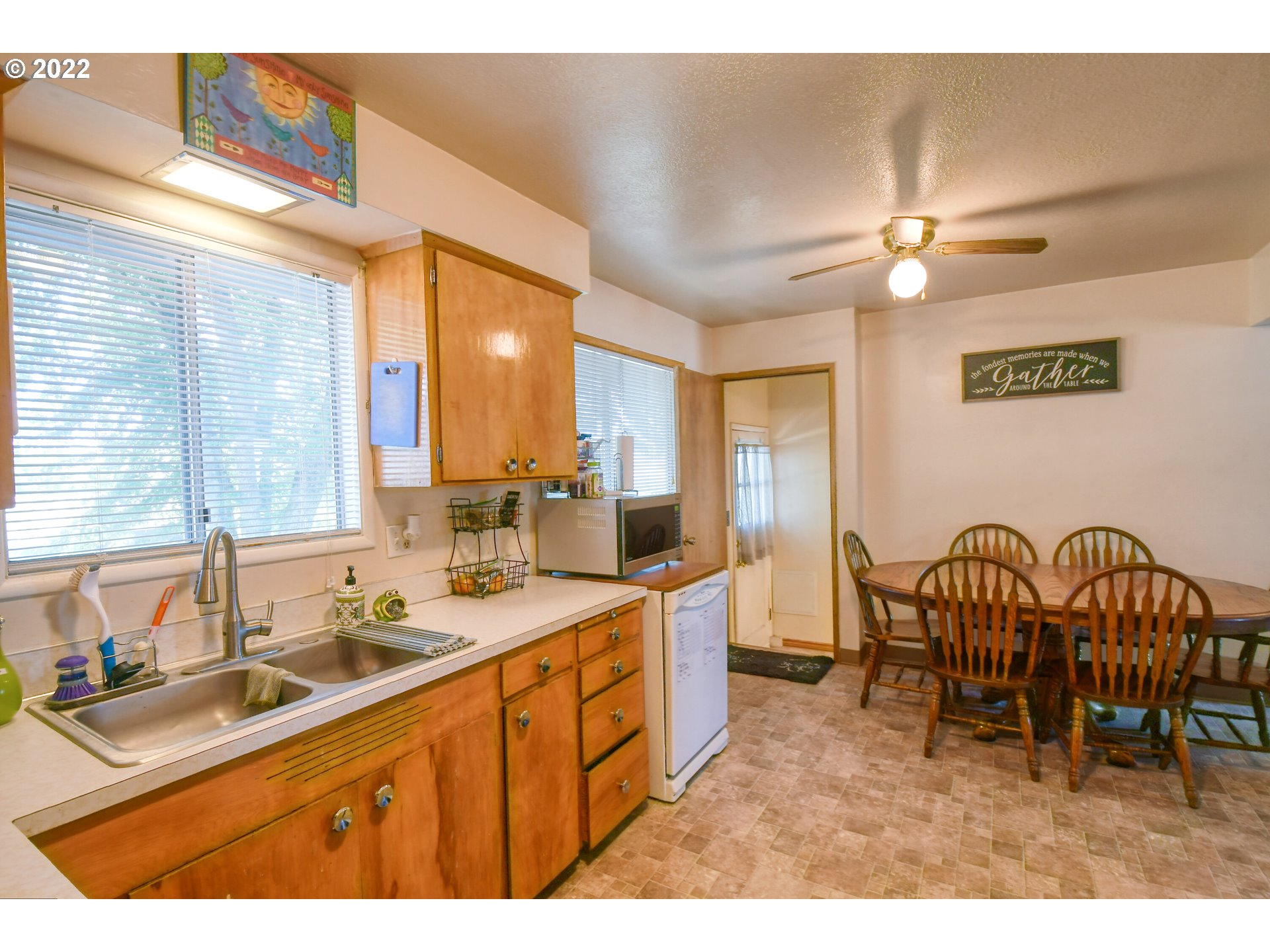 3308 Southwest Kirk Avenue Pendleton, OR 97801 - Photo 9 of 32 a open kitchen with a sink appliances and a dining table