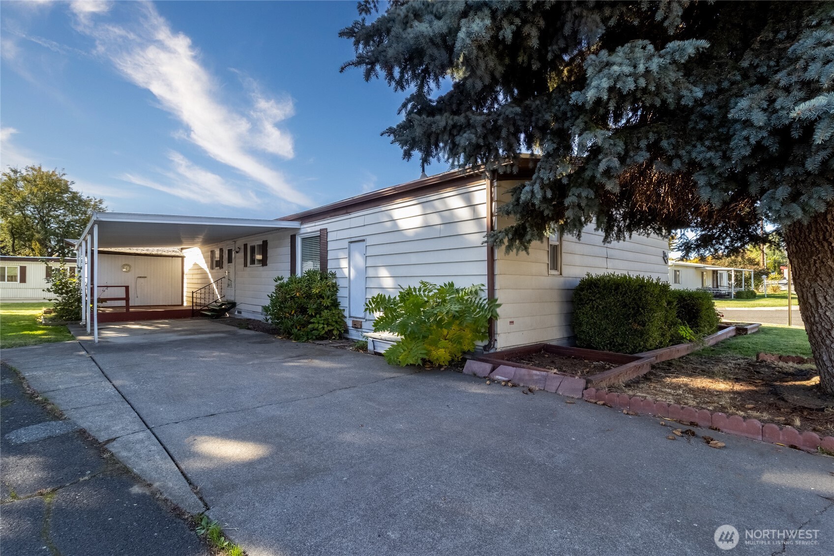 826 Southeast Scenic View Drive College Place, WA 99324 - Photo 25 of 28 a view of a house with a yard and potted plants