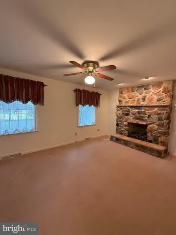 a view of a livingroom with a fireplace