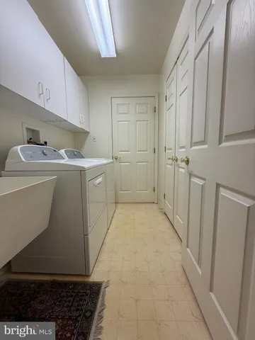 a kitchen with white cabinets