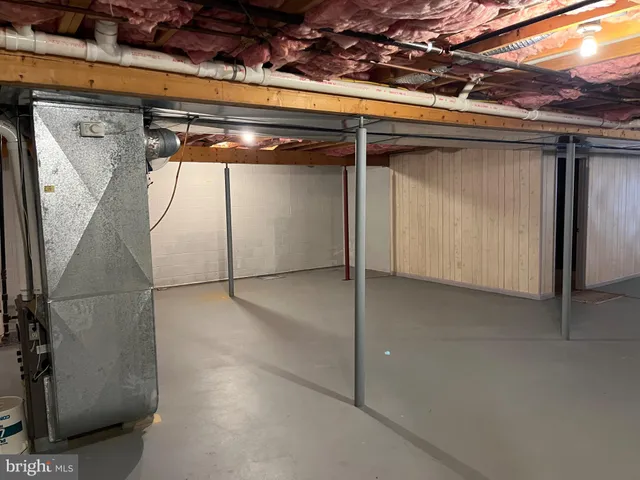 a view of a room with wooden walls