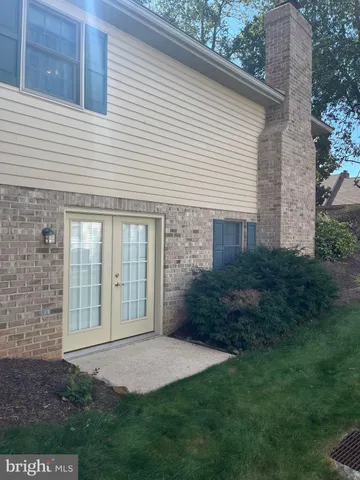 a view of a house with a yard and plants