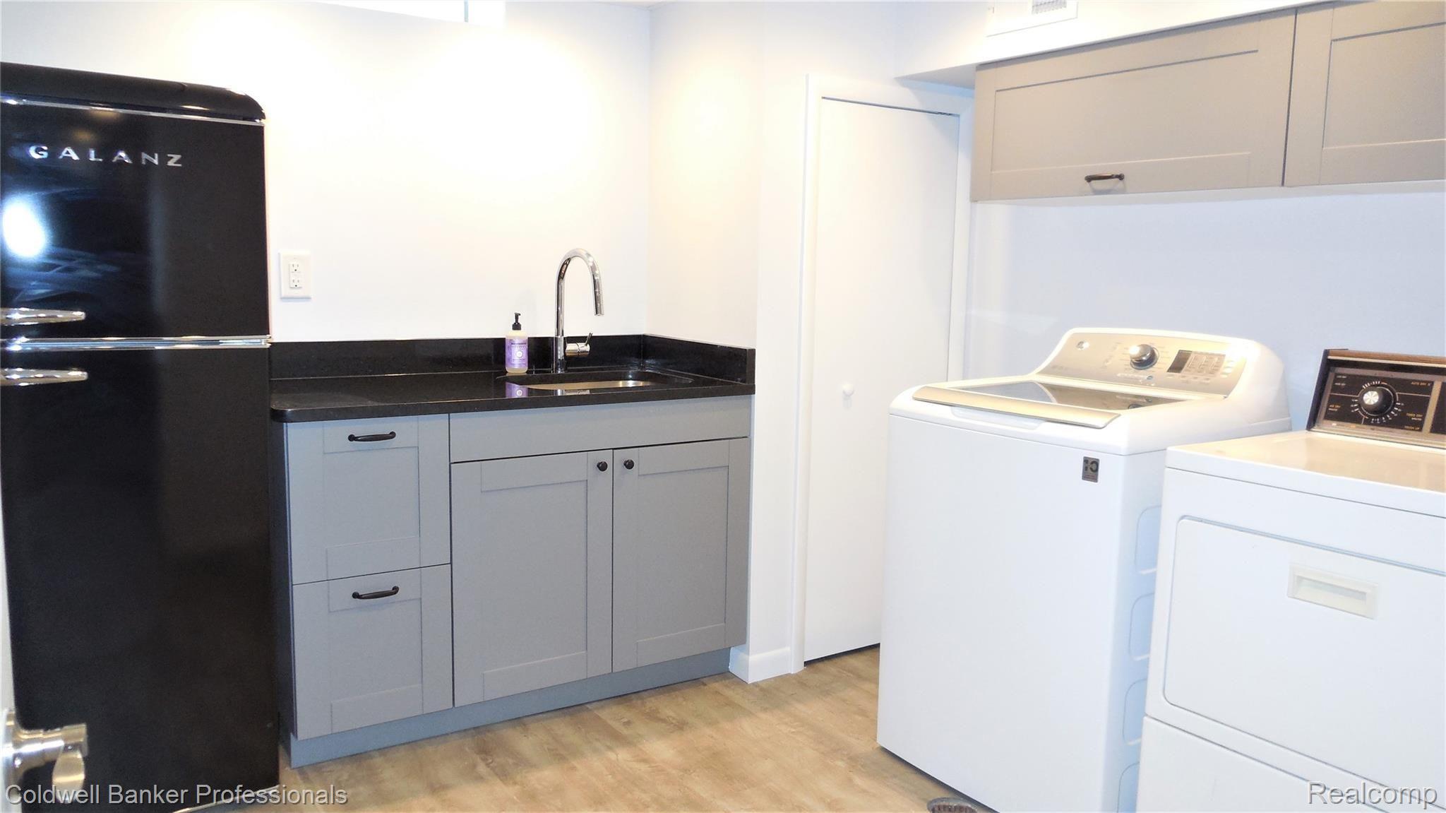 7543 Kingsbridge Road Canton, MI 48187 - Photo 33 of 41 Laundry Rm Galanz Refrigerator