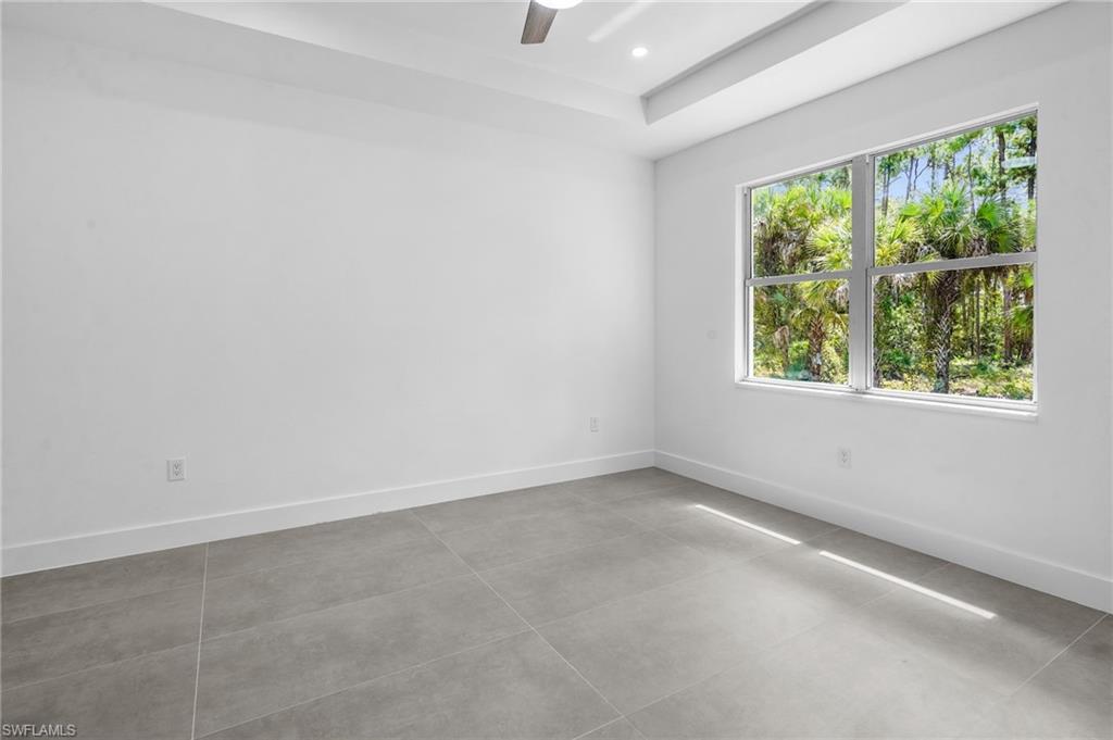 2712 40th Avenue Southeast Naples, FL 34117 - Photo 14 of 41 an empty room with a window