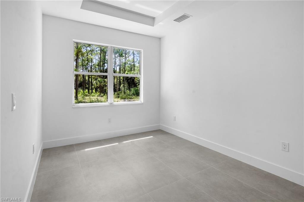 2712 40th Avenue Southeast Naples, FL 34117 - Photo 15 of 41 an empty room with a window