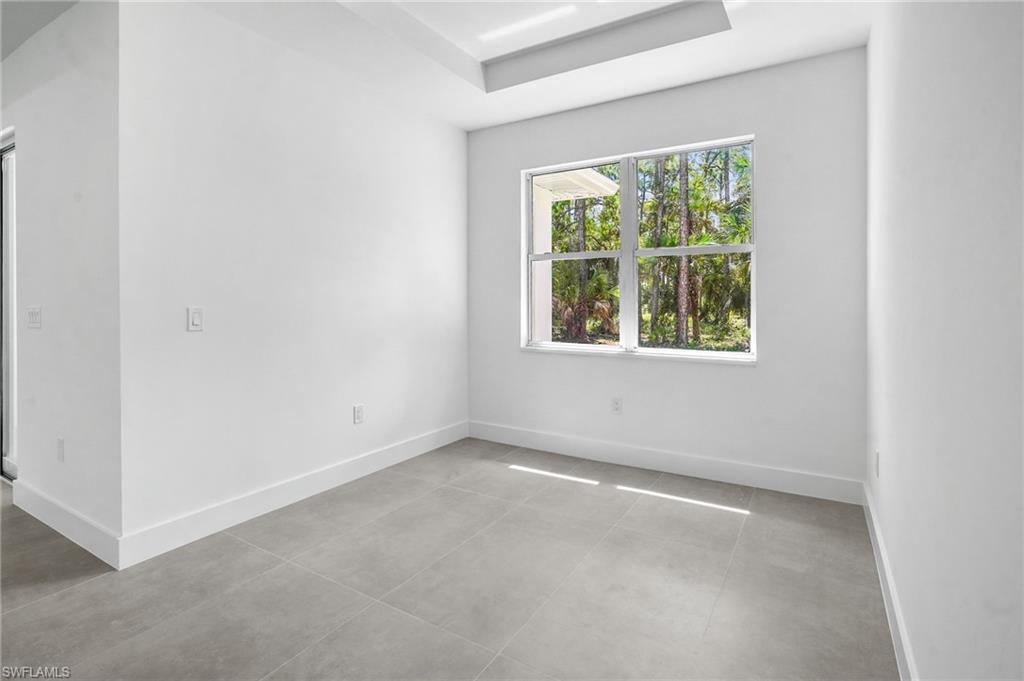 2712 40th Avenue Southeast Naples, FL 34117 - Photo 25 of 41 an empty room with a window