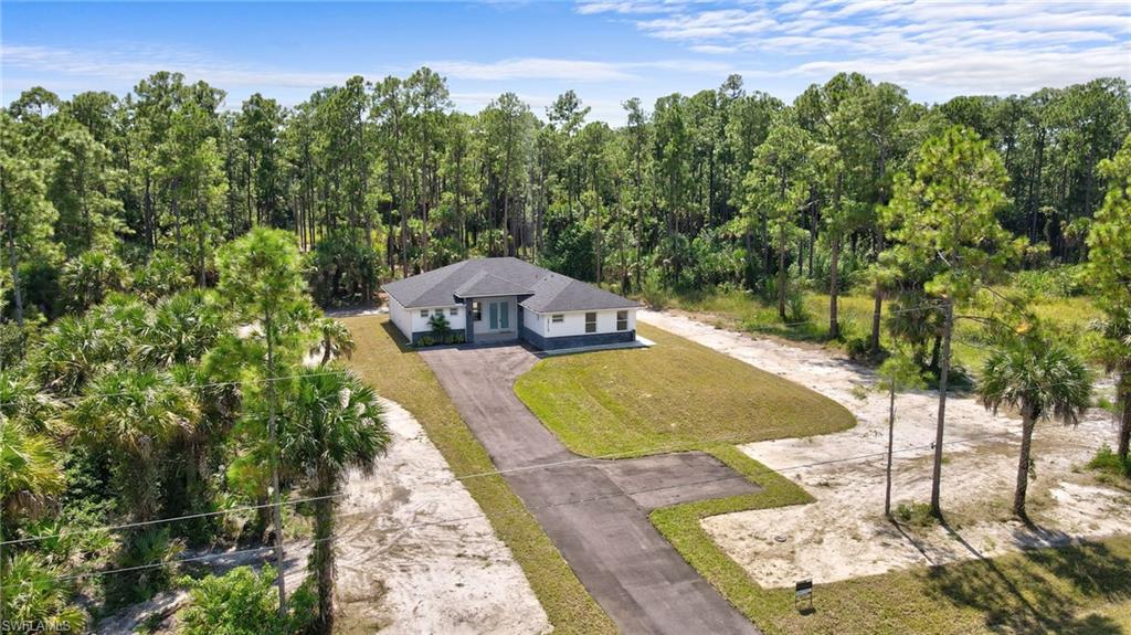 2712 40th Avenue Southeast Naples, FL 34117 - Photo 32 of 41 a view of a swimming pool with an outdoor space