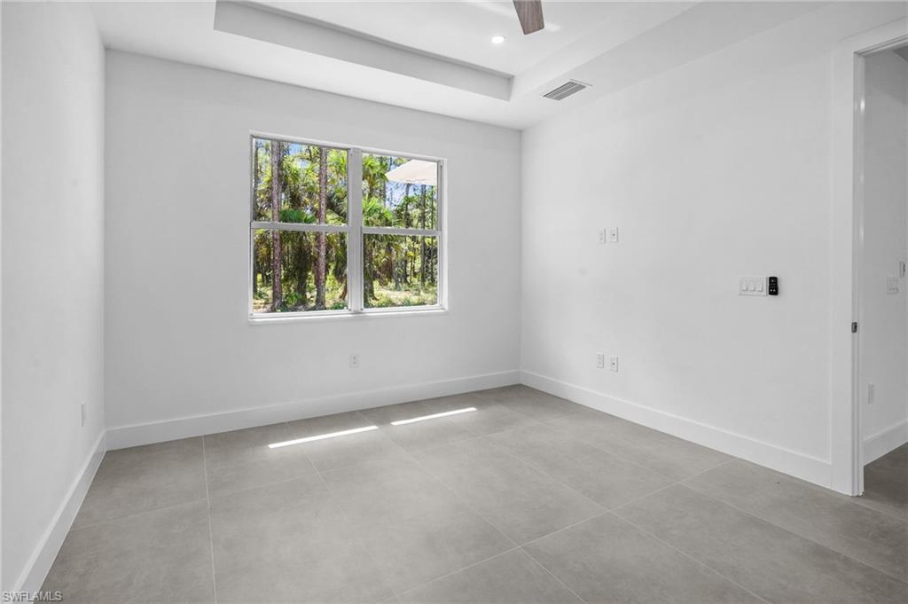 2712 40th Avenue Southeast Naples, FL 34117 - Photo 38 of 41 an empty room with a window