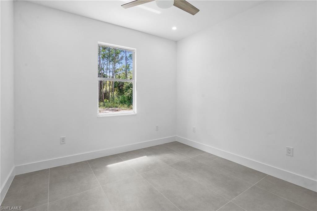 2712 40th Avenue Southeast Naples, FL 34117 - Photo 39 of 41 an empty room with a window