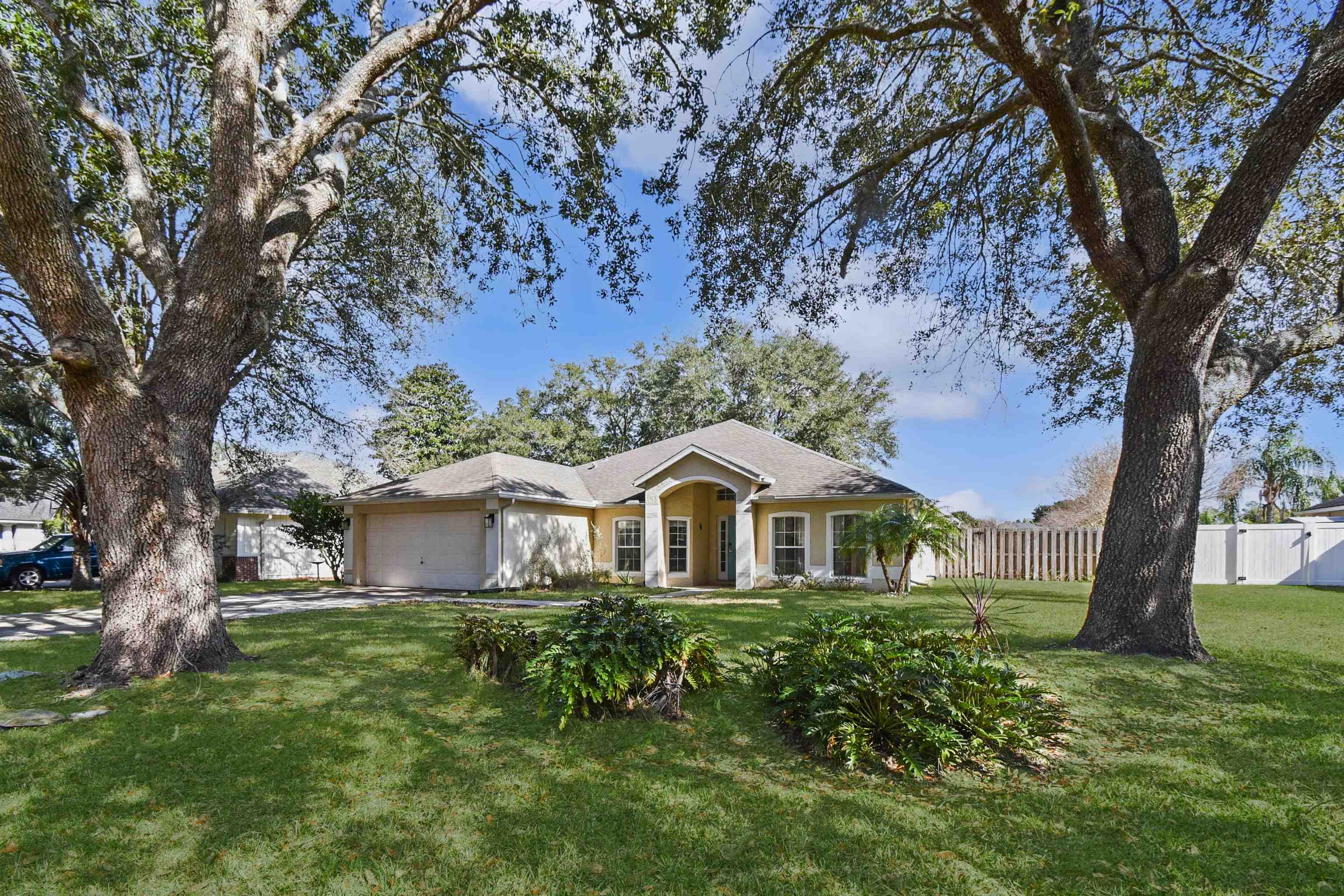 420 Bay Point Way North St. Johns, FL 32259 - Photo 2 of 37 Single story home featuring a garage, stucco siding, and driveway