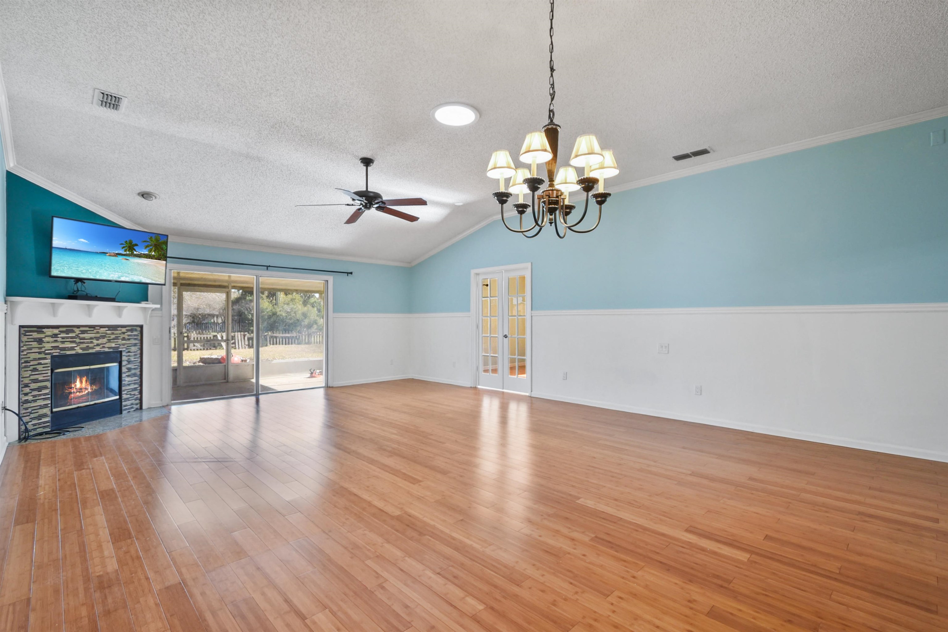 420 Bay Point Way North St. Johns, FL 32259 - Photo 21 of 37 a view of a livingroom with a fireplace wooden floor and chandelier