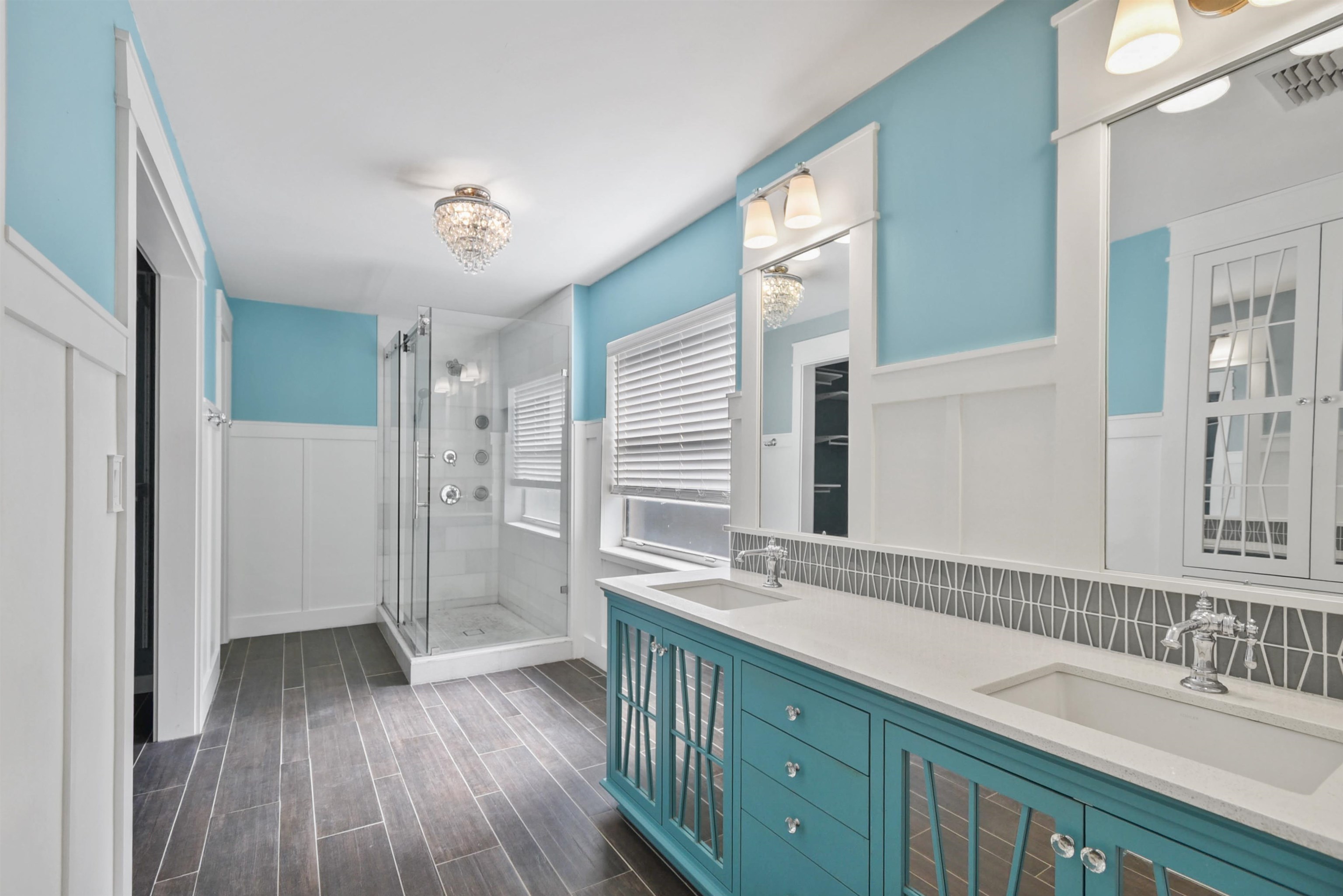 420 Bay Point Way North St. Johns, FL 32259 - Photo 25 of 37 a bathroom with a double vanity sink a mirror and a shower