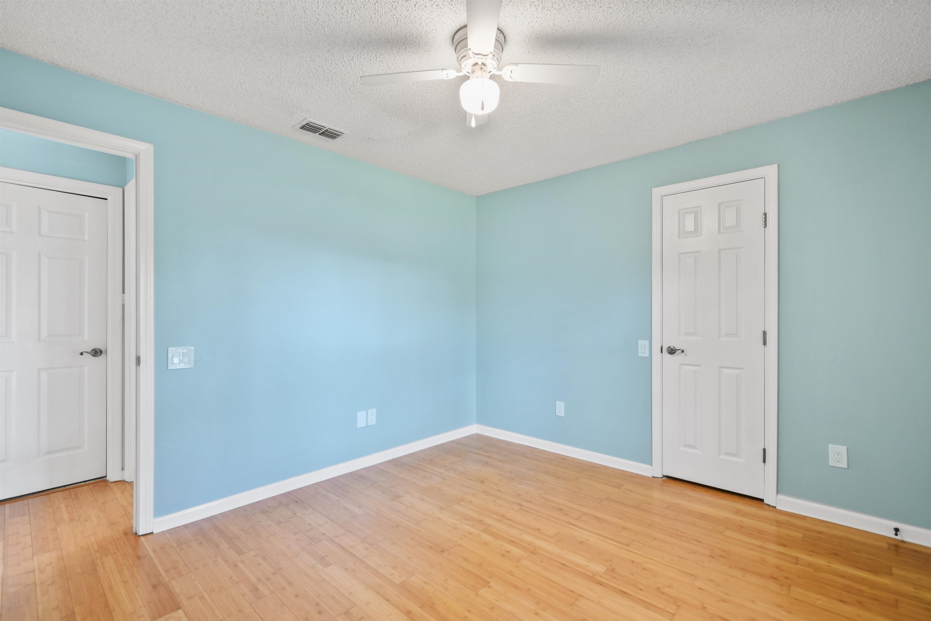 420 Bay Point Way North St. Johns, FL 32259 - Photo 29 of 37 Spare room with a textured ceiling, light wood-style flooring, and a ceiling fan