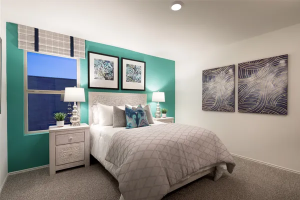 a bedroom with a bed and a wall painting