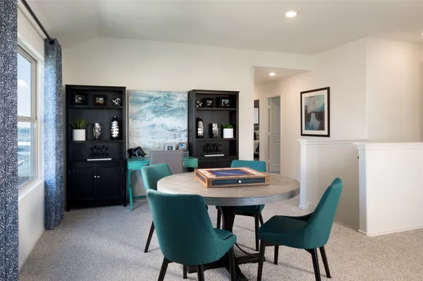 a dining room with furniture and window