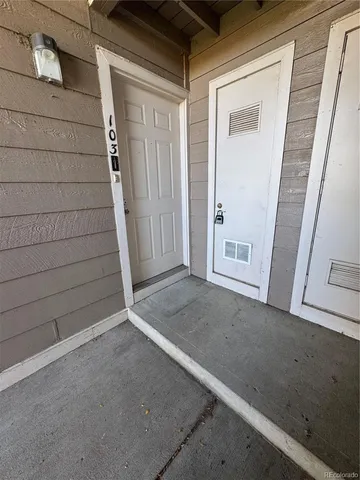 a view of a field with an trees