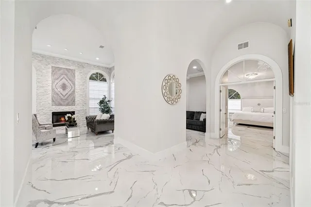 a view of a livingroom with furniture and a fireplace