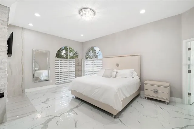 a bedroom with a bed and a view of bathroom