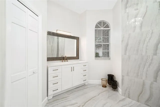 a bathroom with a sink and a mirror
